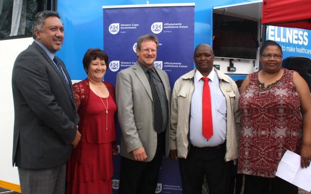 Fltr: Overberg District Director Education, Mr Bertram Loriston, Overberg District Director Health, Ms Wilhelmina Kamfer, Western Cape Minister of Health, Mr Theuns Botha, Theewaterskloof Deputy Mayor, Cllr Mlulami Tshaka and the Principal of Umyezo Wama Apile Combined School, Ms Gladys Badela, outside the Wellness Mobile.